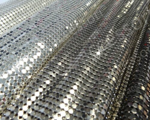 Maglie metalliche in ottone con elementi piatti